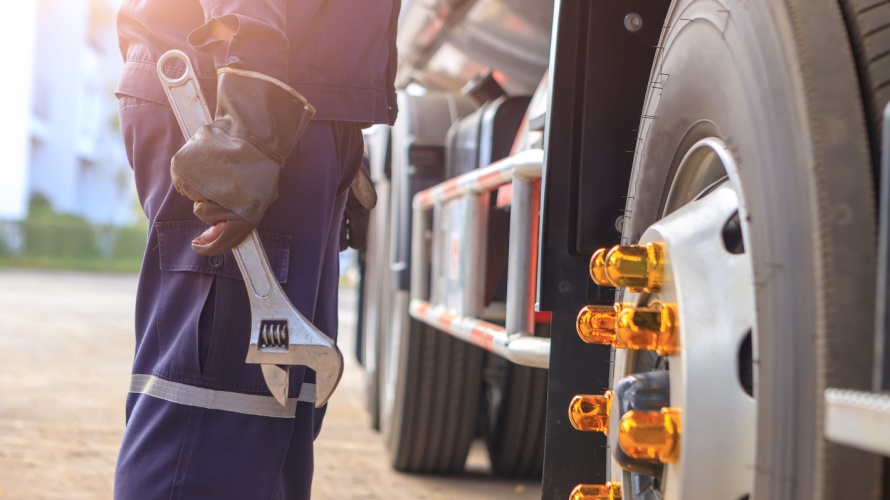 Mechanic performing emergency roadside repair