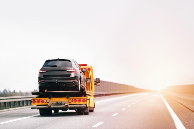 Tow truck transporting a vehicle